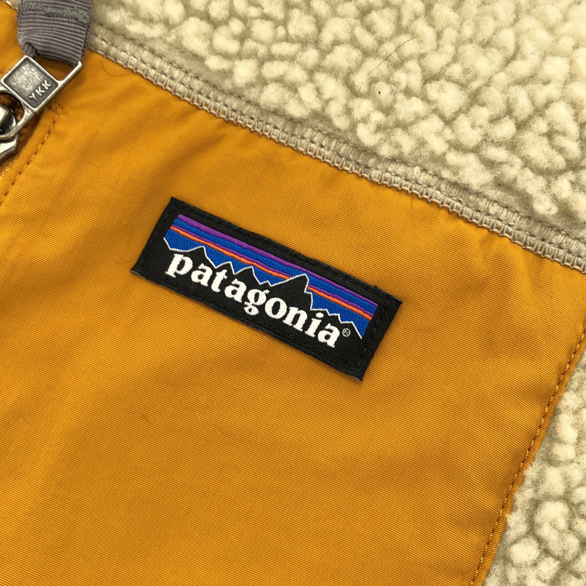columbia コロンビア 23048FA19 ベージュ×オレンジ クラシック レトロX ベスト トップス