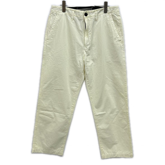 STONE ISLAND ストーンアイランド イエロー ロゴパッチウォッシュドトラウザーパンツ ボトムス