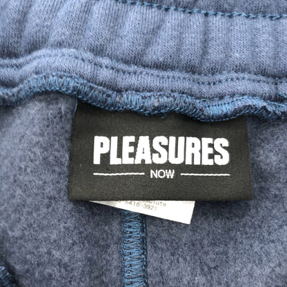 PLEASURES プレジャーズ ブルー ロゴプリント 裏起毛 スウェットパンツ ボトムス