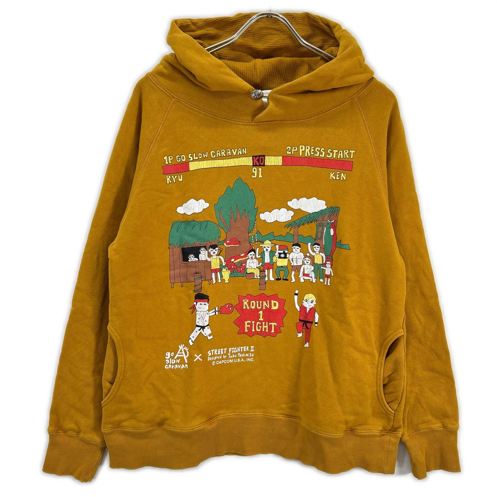 GO SLOW CARAVAN ゴースローキャラバン 【×STREET FIGHTER2】イエロー プリント フーデッドプルオーバー トップス