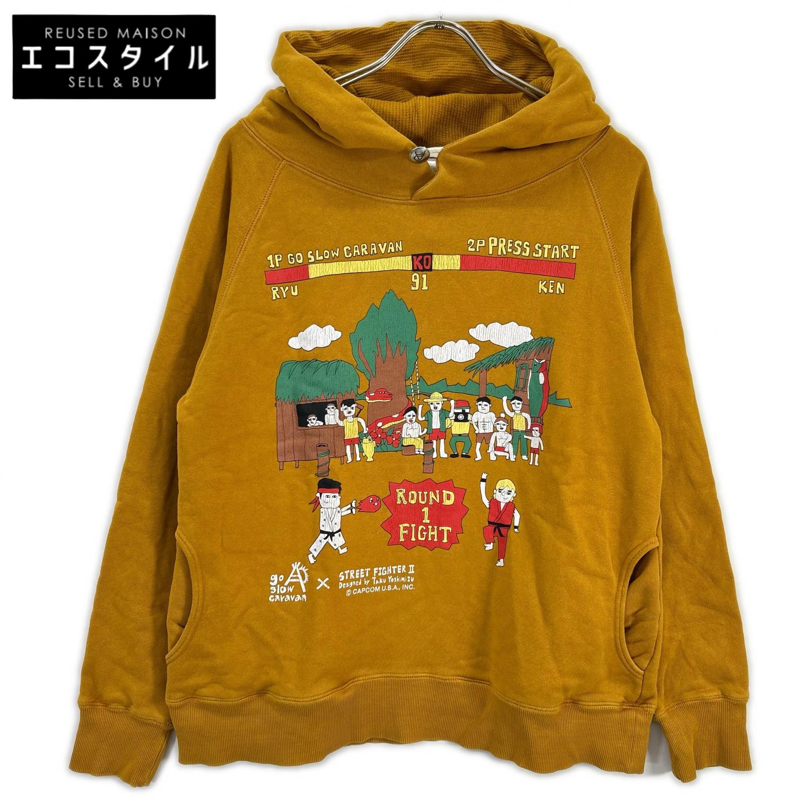 GO SLOW CARAVAN ゴースローキャラバン 【×STREET FIGHTER2】イエロー プリント フーデッドプルオーバー トップス