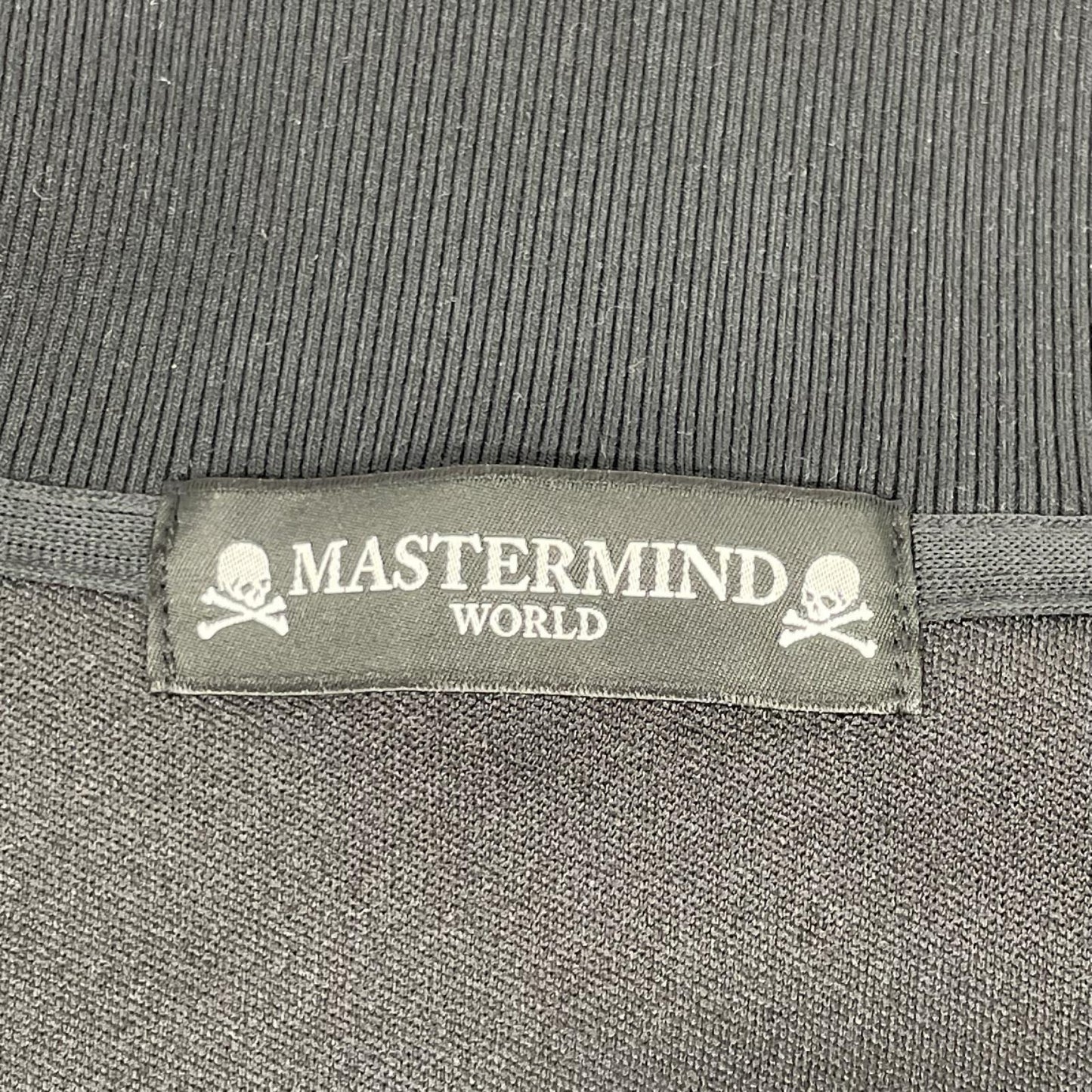 mastermind マスターマインド ×UMBRO ブラック バックロゴプリント トラックジャケット ジャケット