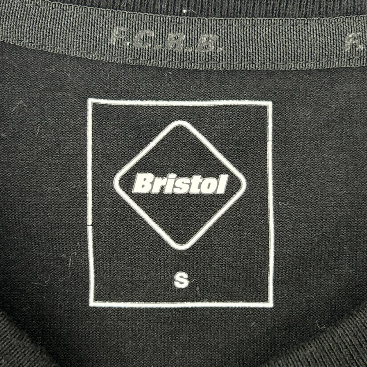 F.C.Real Bristol エフシーリアルブリストル 252100 Black Trophy Crest T-shirt top