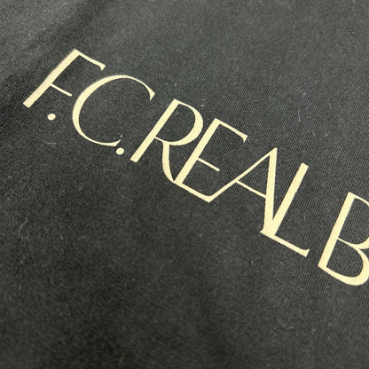 F.C.Real Bristol エフシーリアルブリストル 252100 ブラック トロフィー クレスト Tシャツ トップス
