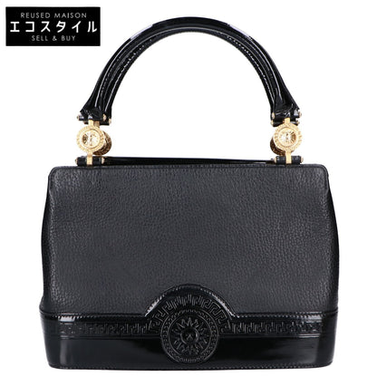 GIANNI VERSACE GIANNI VERSACE Sunburst leather/patent leather handbag