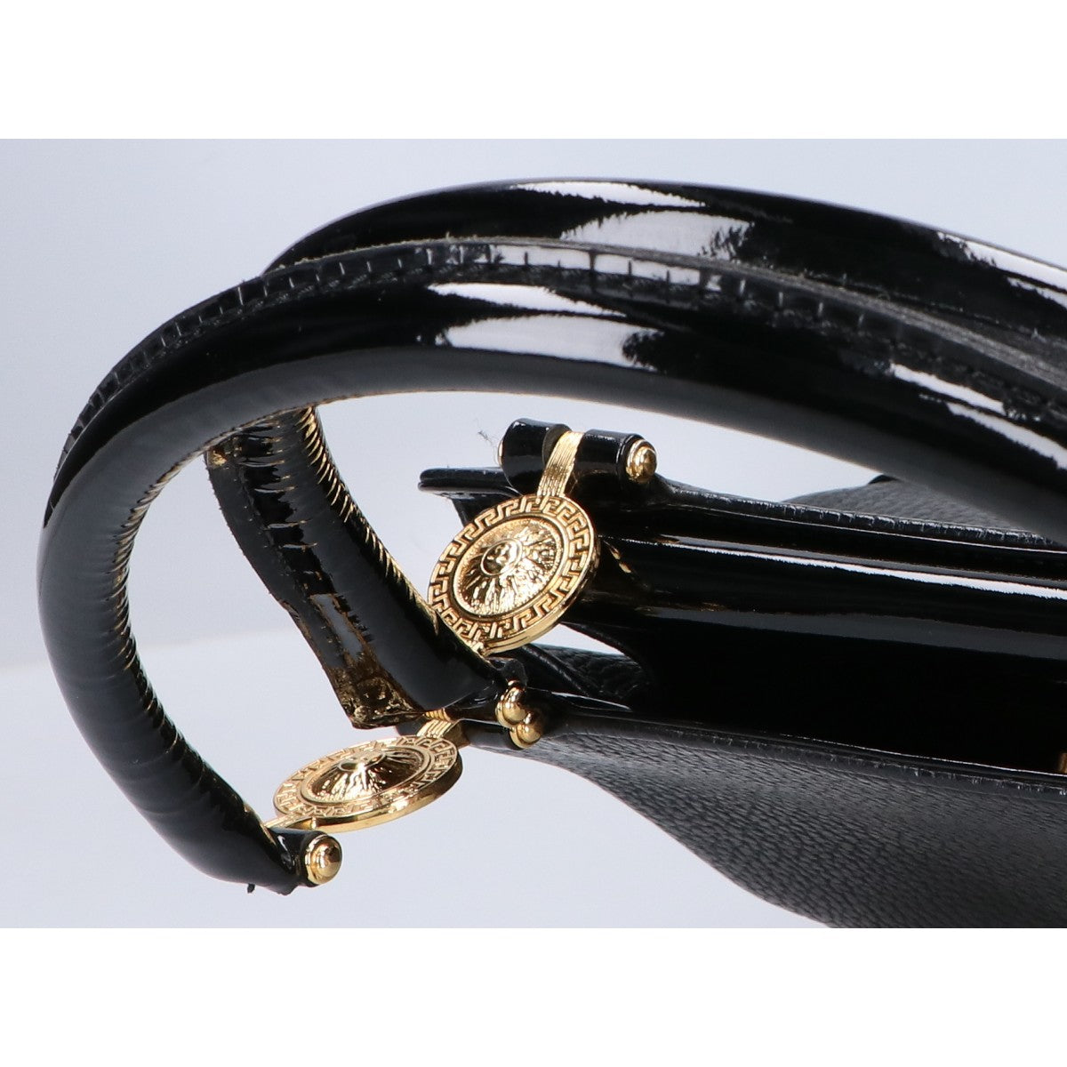 GIANNI VERSACE GIANNI VERSACE Sunburst leather/patent leather handbag