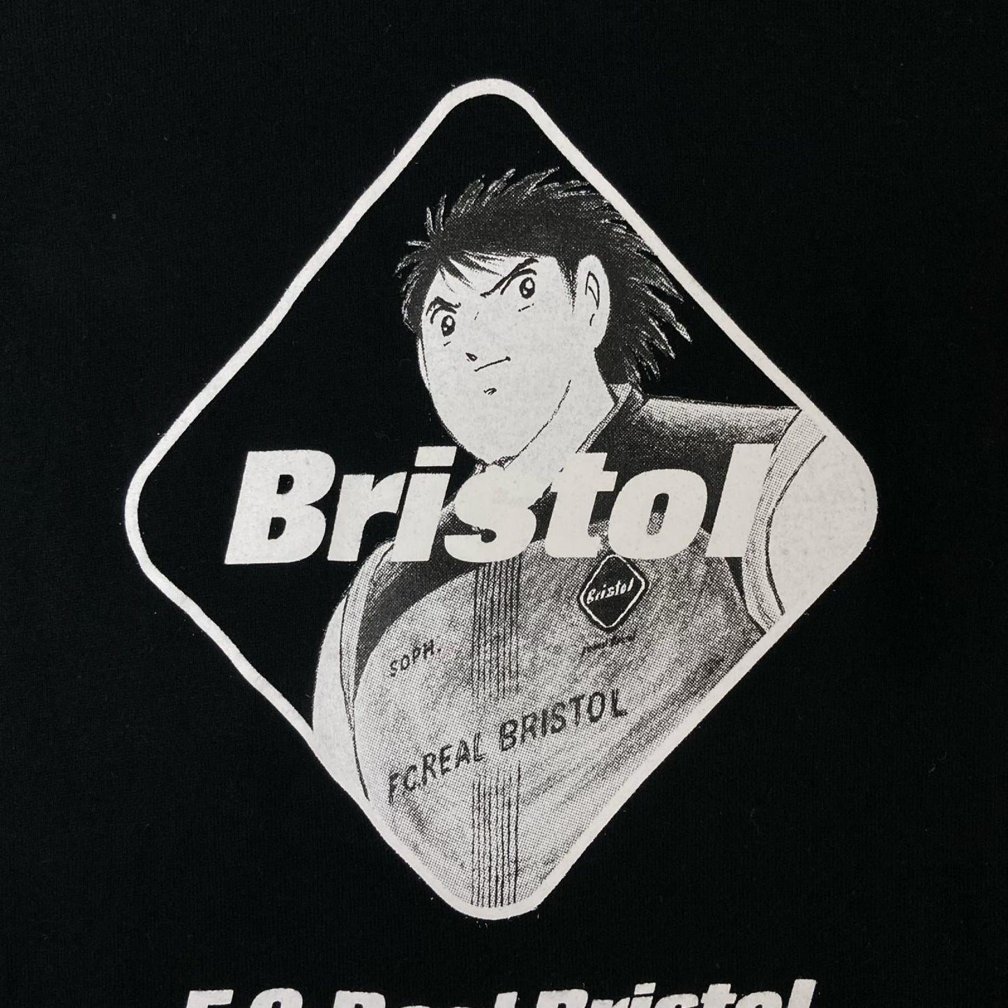 F.C.Real Bristol エフシーリアルブリストル 26SS ×キャプテン翼 FCRB-260174 KOJIRO HYUGA EMBLEM Tシャツ トップス