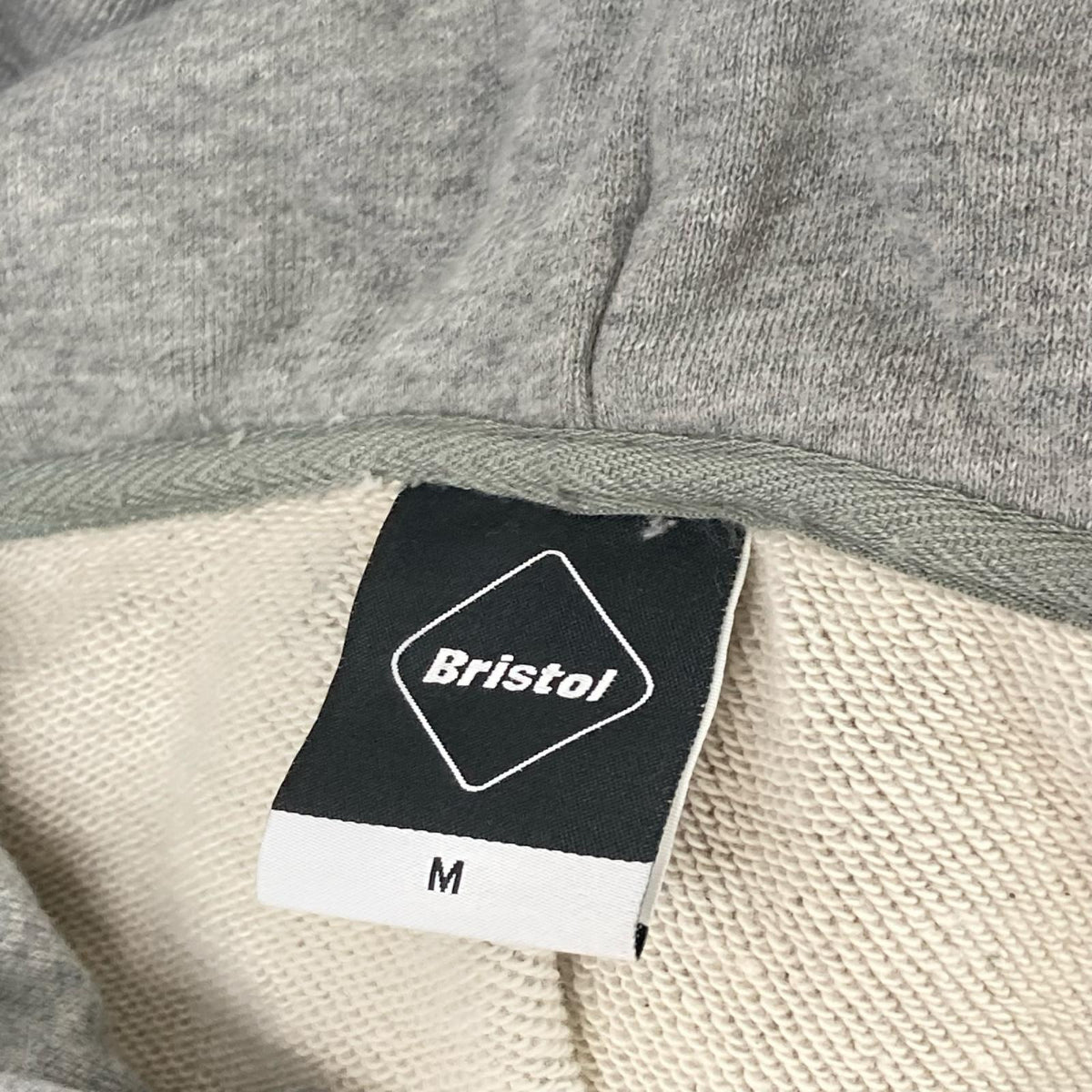 F.C.Real Bristol エフシーリアルブリストル FCRB-190053 グレー ファイヤーパターン ロゴ フーディープルオーバー トップス