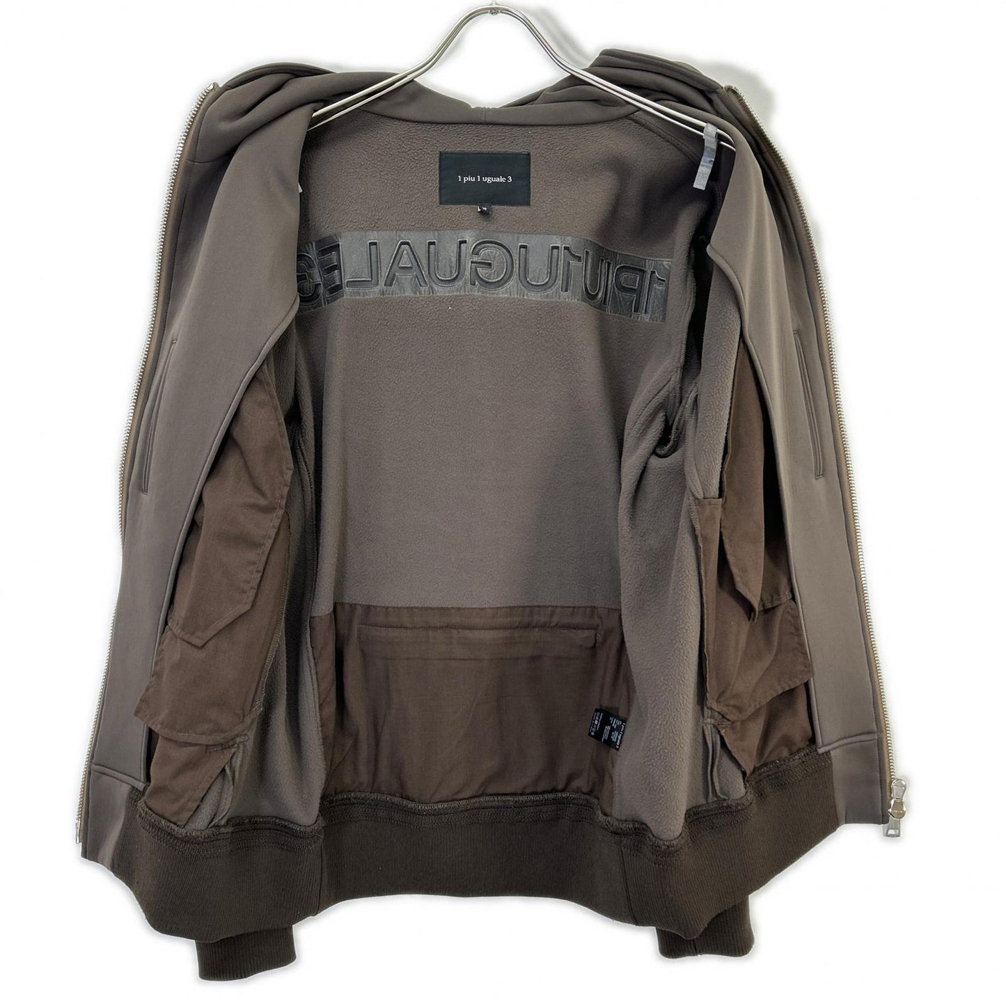 1piu1uguale3 ウノピゥウノウグァーレトレ MRB696 ブラウン TRAVEL ZIP PARKA トップス
