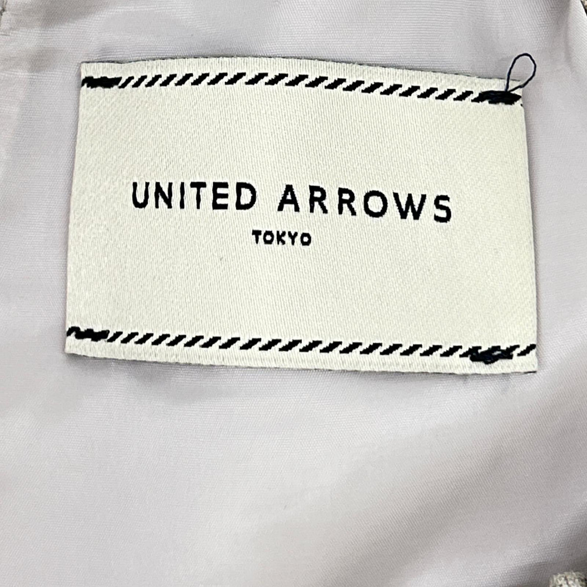 UNITED ARROWS United Arrows beige Spiree IAS pleated tapered pants bottoms