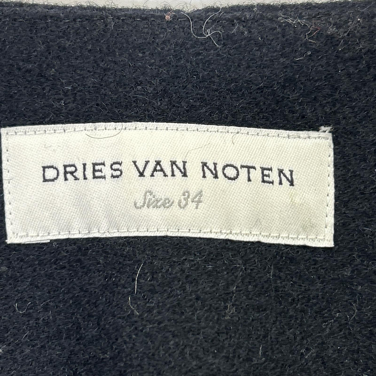 DRIES VAN NOTEN Dries Van Noten Black wool-blend leopard-fur-lined collarless long coat Coat