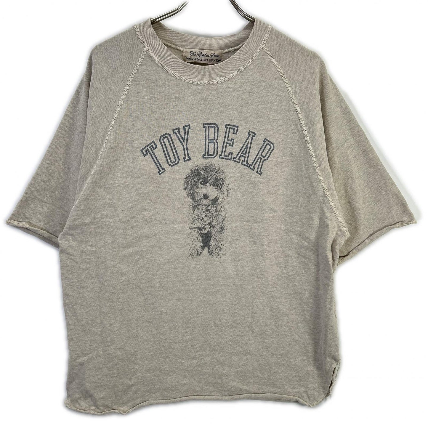 REMI RELIEF レミレリーフ ×HUG O WaR 25SS オートミール/ベージュ コットン TOY BEAR ヴィンテージ加工 天竺ラグランスリーブTシャツ トップス