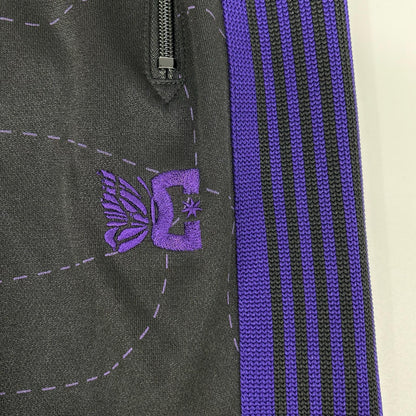 needles ニードルズ 【×DC SHOES】MR609 ブラック×パープル Track Pant - Poly Smooth / Printed ステッチワークプリントトラックパンツ ボトムス