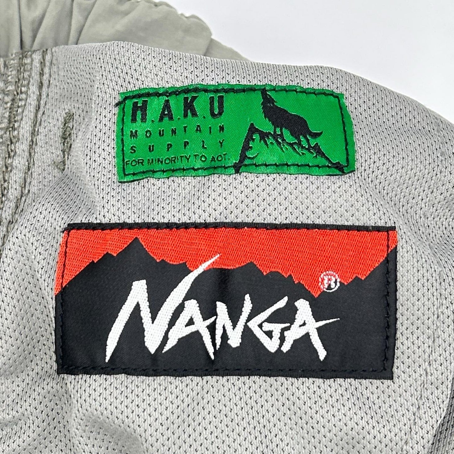 NANGA ナンガ 【×H.A.K.U】カーキ メッシュポケット BIKU TROUSERS ボトムス
