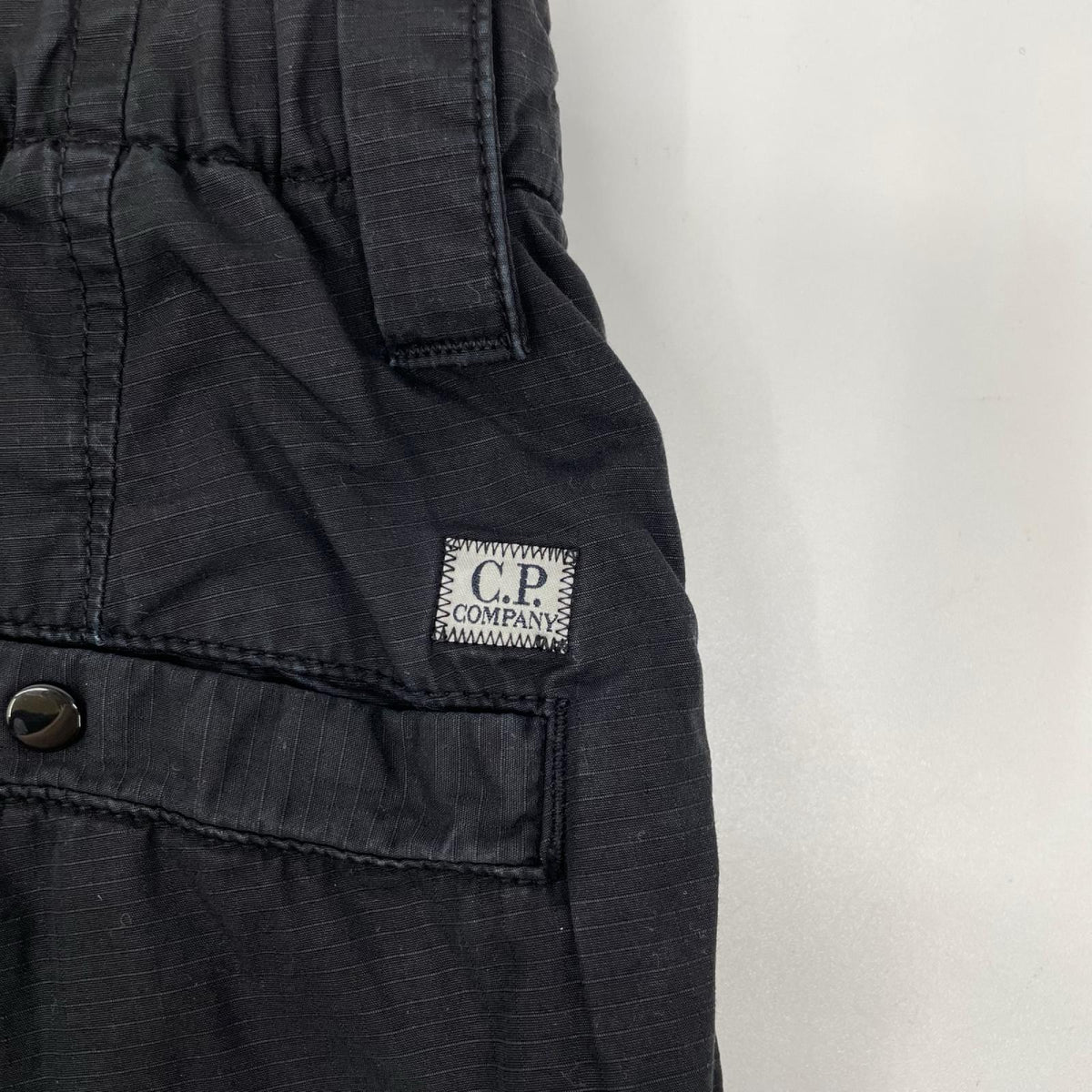 C.P.COMPANY シーピーカンパニー 20CMPA248A 26SS ブラック Cargo Pants In Cotton Rip-Stop Gunetal パンツ ボトムス